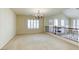 Upstairs loft featuring natural light, a chandelier, and views of the first floor at 7641 Jacaranda Bay St, Las Vegas, NV 89139