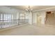 Upstairs loft featuring natural light, a chandelier, and views of the staircase at 7641 Jacaranda Bay St, Las Vegas, NV 89139