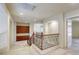 Carpeted staircase and upper hallway with built-in cabinets for storage at 7641 Jacaranda Bay St, Las Vegas, NV 89139