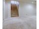 Carpeted stairway to upper level with natural lighting at 7641 Jacaranda Bay St, Las Vegas, NV 89139