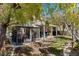 Beautiful backyard featuring a gazebo, covered patio with seating, and a grassy lawn area at 8125 Boxberry Ave, Las Vegas, NV 89131