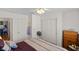 Bedroom with hardwood floors, a ceiling fan and light, and ample closet space at 8125 Boxberry Ave, Las Vegas, NV 89131