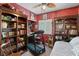 Cozy bedroom featuring a built-in desk, bookshelves, and neutral carpet at 8125 Boxberry Ave, Las Vegas, NV 89131