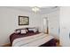 Bedroom with a large bed and a view into the bathroom at 8125 Boxberry Ave, Las Vegas, NV 89131