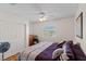 Bright bedroom featuring a ceiling fan, a window with shutters, and a closet at 8125 Boxberry Ave, Las Vegas, NV 89131