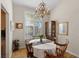 Charming dining area featuring a chandelier, shuttered windows, and a traditional-style table at 8125 Boxberry Ave, Las Vegas, NV 89131