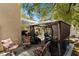 Outdoor gazebo with comfortable seating and a view of the backyard and covered patio at 8125 Boxberry Ave, Las Vegas, NV 89131