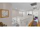 Bright upstairs hallway featuring white trim and hardwood floors at 8125 Boxberry Ave, Las Vegas, NV 89131