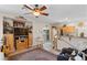 Cozy living room area showcases a kitchen view, tile floors, and sliding door to the backyard at 8125 Boxberry Ave, Las Vegas, NV 89131