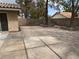 Spacious backyard features a patio with interlocking pavers, mature trees, and a hammock at 8154 Flanders Terrace Dr, Las Vegas, NV 89123
