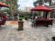 Backyard features a large patio, dining area, comfortable seating, and fire pit at 8154 Flanders Terrace Dr, Las Vegas, NV 89123