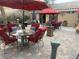 Well appointed patio with outdoor seating, dining area, and lush landscaping at 8154 Flanders Terrace Dr, Las Vegas, NV 89123
