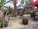 Backyard patio with fire pit, mature trees, garden boxes and a hammock at 8154 Flanders Terrace Dr, Las Vegas, NV 89123