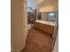 Bathroom with a double sink vanity, tiled floors, and a glass-enclosed shower at 8154 Flanders Terrace Dr, Las Vegas, NV 89123