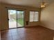 Bedroom with tile floors, ceiling fan, and sliding door access to the backyard at 8154 Flanders Terrace Dr, Las Vegas, NV 89123