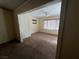 Bedroom showcasing a ceiling fan, bright windows, and a view of the interior room at 8154 Flanders Terrace Dr, Las Vegas, NV 89123