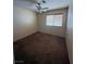 Simple bedroom includes neutral walls, carpet, a ceiling fan, and natural light at 8154 Flanders Terrace Dr, Las Vegas, NV 89123