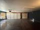Spacious garage features two doors, a window with blinds, and a hardwood floor at 8154 Flanders Terrace Dr, Las Vegas, NV 89123