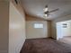 Comfortable living room with a ceiling fan, plush carpeting, and a bright window at 8154 Flanders Terrace Dr, Las Vegas, NV 89123