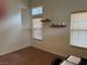 Neutral living room with tile floors, two windows and a decorative shelf at 8154 Flanders Terrace Dr, Las Vegas, NV 89123