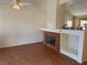 Spacious living room features tile floors, a fireplace, and open shelving at 8154 Flanders Terrace Dr, Las Vegas, NV 89123