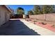 Backyard featuring a red tiled patio and a block wall at 8216 Gillette St, Las Vegas, NV 89117