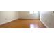 Cozy bedroom featuring hardwood floors and ample natural light at 8216 Gillette St, Las Vegas, NV 89117