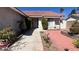 Well-maintained home with mature landscaping and a tidy walkway leading to the front door at 8216 Gillette St, Las Vegas, NV 89117