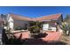 A charming home with mature landscaping and a tile roof is well-maintained at 8216 Gillette St, Las Vegas, NV 89117