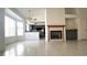 The kitchen features an open view, fireplace, and kitchen island at 8216 Gillette St, Las Vegas, NV 89117