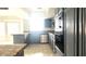 Modern kitchen with stainless steel appliances and sleek gray cabinetry at 8216 Gillette St, Las Vegas, NV 89117