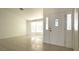 Bright living room featuring a large bay window and tile flooring at 8216 Gillette St, Las Vegas, NV 89117