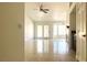 Open living room with ceiling fan and doors leading to outdoor space at 8216 Gillette St, Las Vegas, NV 89117
