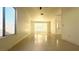 Spacious living room with lots of natural light and tile flooring at 8216 Gillette St, Las Vegas, NV 89117
