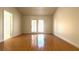Bright living room featuring French doors and hardwood flooring at 8216 Gillette St, Las Vegas, NV 89117