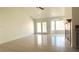 Open floor plan living room with doors to the exterior and a decorative fireplace at 8216 Gillette St, Las Vegas, NV 89117