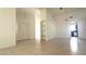 Bright living room with built-in shelving and neutral tile flooring at 8216 Gillette St, Las Vegas, NV 89117