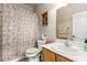 Bright bathroom featuring a single sink and shower with floral pattern curtain at 8266 Lincoln Valley St, Las Vegas, NV 89123