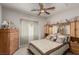 This bedroom features coordinated wood furniture and a ceiling fan at 8266 Lincoln Valley St, Las Vegas, NV 89123