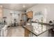 Bright kitchen with granite countertops, stainless steel appliances, and a cozy breakfast nook by the window at 8266 Lincoln Valley St, Las Vegas, NV 89123