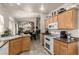 Open kitchen showcasing tile floors, granite countertops, and views into the dining and living areas at 8266 Lincoln Valley St, Las Vegas, NV 89123