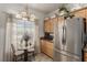 Kitchen area features stainless steel appliances and a breakfast nook with view of the backyard at 8266 Lincoln Valley St, Las Vegas, NV 89123