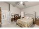 Serene main bedroom with carpet floors, ceiling fan, and ample natural light. Entryway to main bathroom at 8266 Lincoln Valley St, Las Vegas, NV 89123