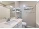 Modern bathroom featuring a large mirror, white vanity, and built in shelving at 8490 Classique Ave # 101, Las Vegas, NV 89178