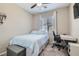 Bright, modern bedroom with a comfortable bed and a dedicated workspace at 8490 Classique Ave # 101, Las Vegas, NV 89178