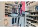 Walk-in closet with custom shelving and clothing racks for optimal storage at 8490 Classique Ave # 101, Las Vegas, NV 89178