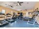 Bright fitness center equipped with treadmills, elliptical machines, weights and exercise equipment at 8490 Classique Ave # 101, Las Vegas, NV 89178