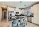Modern kitchen featuring stainless steel appliances, granite countertops, and an island with seating at 8490 Classique Ave # 101, Las Vegas, NV 89178