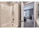 Bathroom with a shower and a view to a modern bedroom at 8490 Classique Ave # 101, Las Vegas, NV 89178