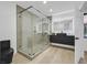 Modern bathroom featuring glass-enclosed shower, sleek vanity, and contemporary fixtures at 8717 Kingship Ct, Las Vegas, NV 89129